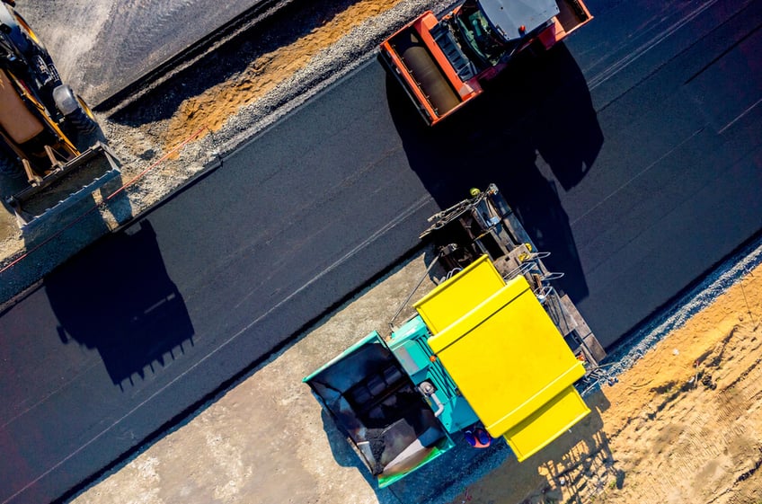 Asphalting Cost Guide - Aerial view on the new asphalt road under construction (1)