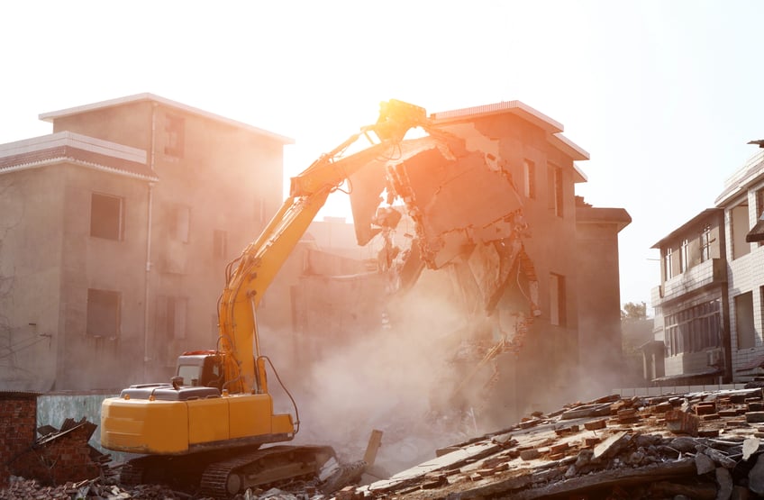 Demolitions costs-Bulldozer demolished old building.