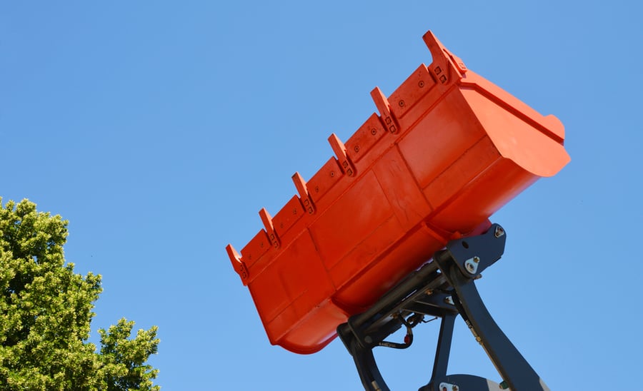 Digging excavator bucket, loading tractor bucket attachment lifted up in the air