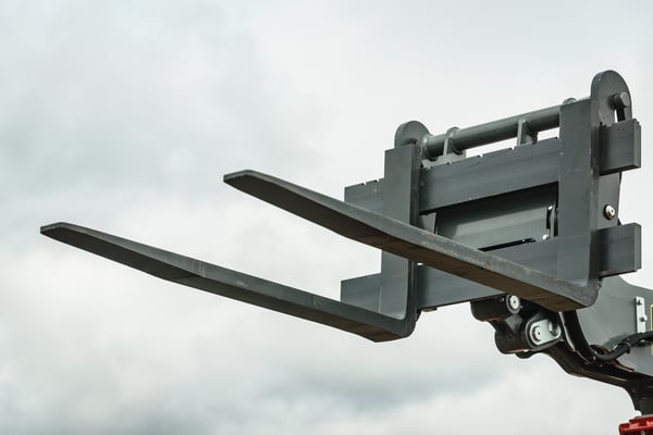 Forklift industrial loader or stacker against sky. Part of agricultural machine. Telescopic handler.