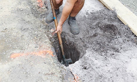 digging-post-hole-in-concrete