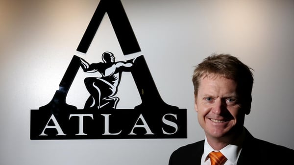 Managing Director of Atlas Iron with logo in the background