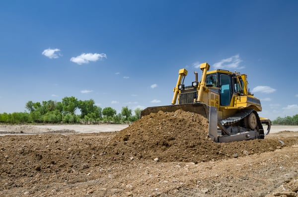 bulldozer-digging-dirt-construction-site