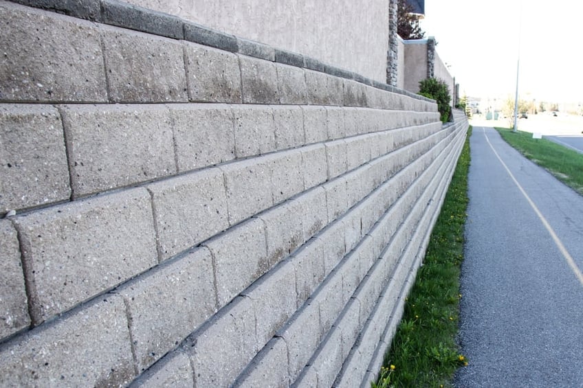 Concrete retaining wall on building boundary