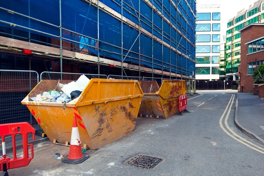 Skip bins next to a construction site on the roadside