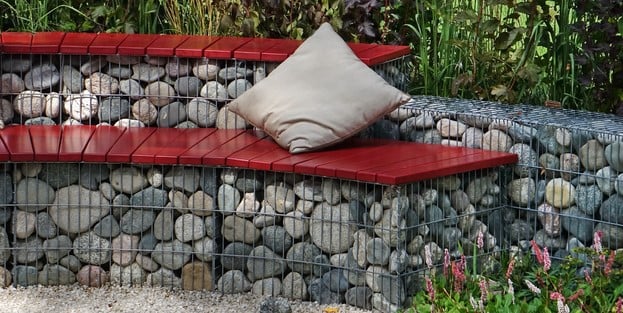 Seat retaining wall next to a garden bed