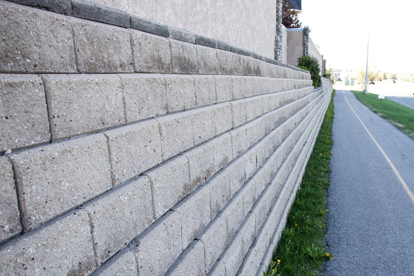 Concrete retaining wall on building boundary