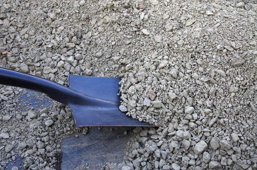 shovel picking up road base aggregate
