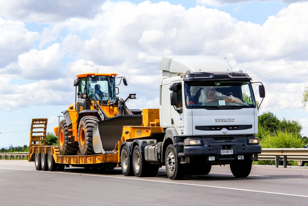 Small truck with low loader and digger