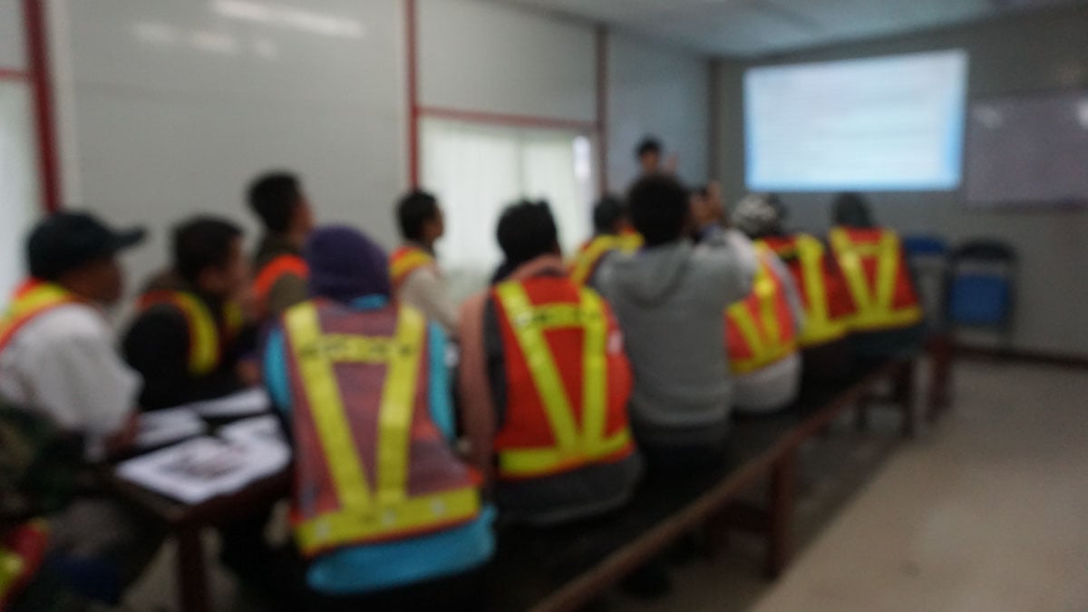 A class of construction workers in a free training session