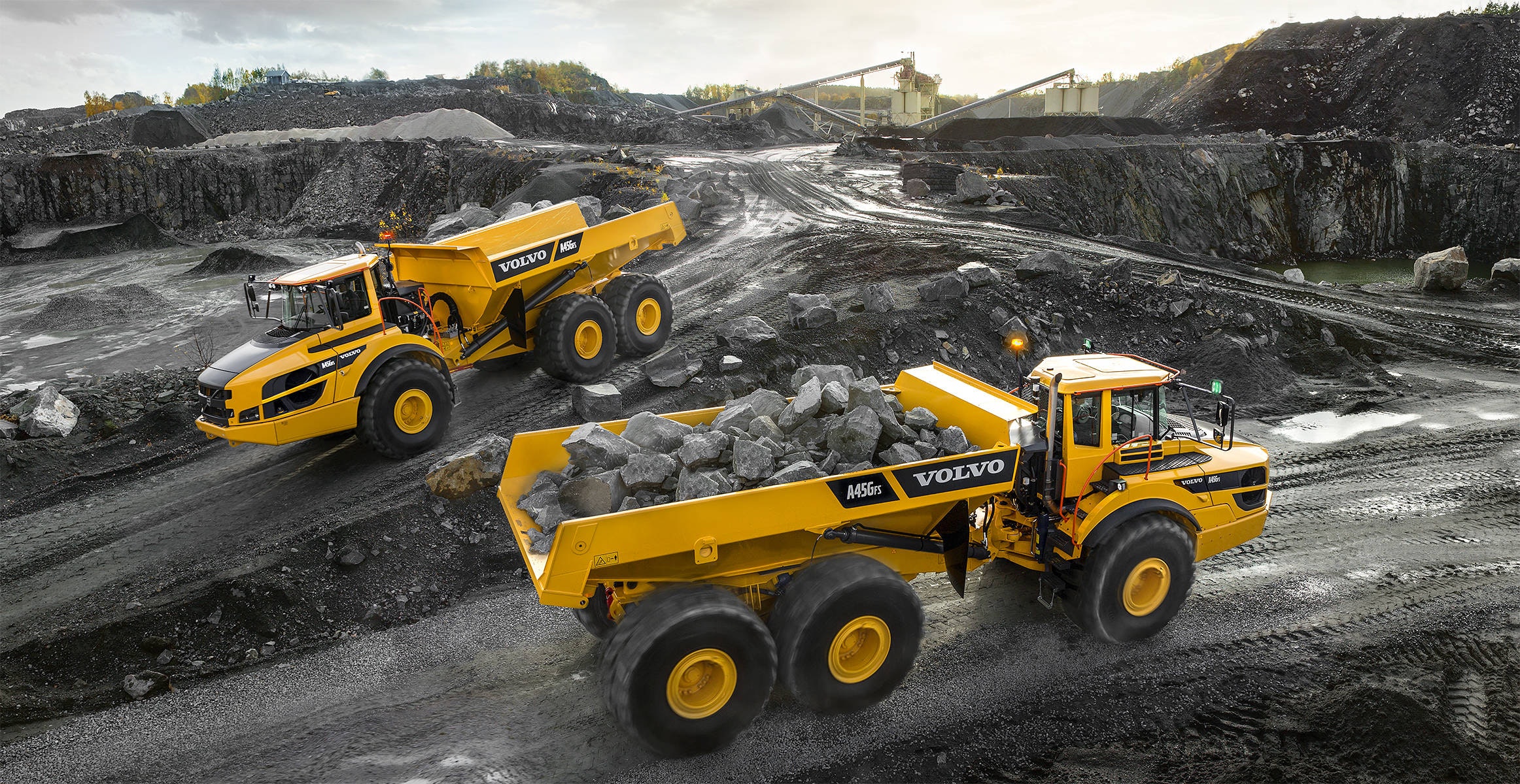 Two Volvo articulated haulers operating on a mining site